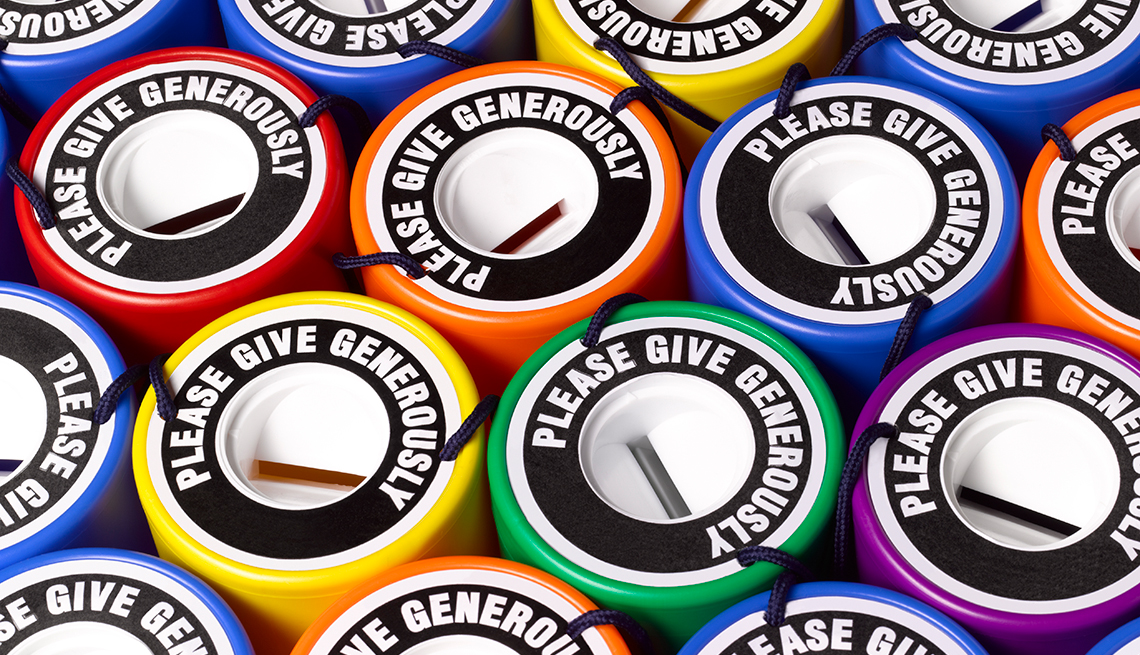 top view montage of brightly colored donation coin collection containers that all read, "Please Give Generously" top view montage of brightly colored donation coin collection containers that all read, "Please Give Generously"